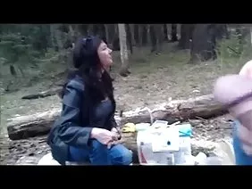 Cute Asian lowers her jeans and gives in her pussy