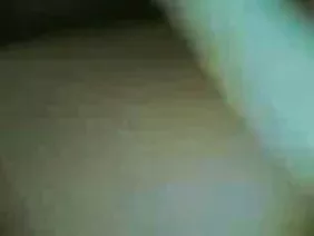 Lonely belly-headed woman caresses her kliter on the bed
