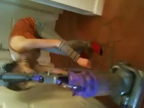 Sexy blonde masturbating in the kitchen